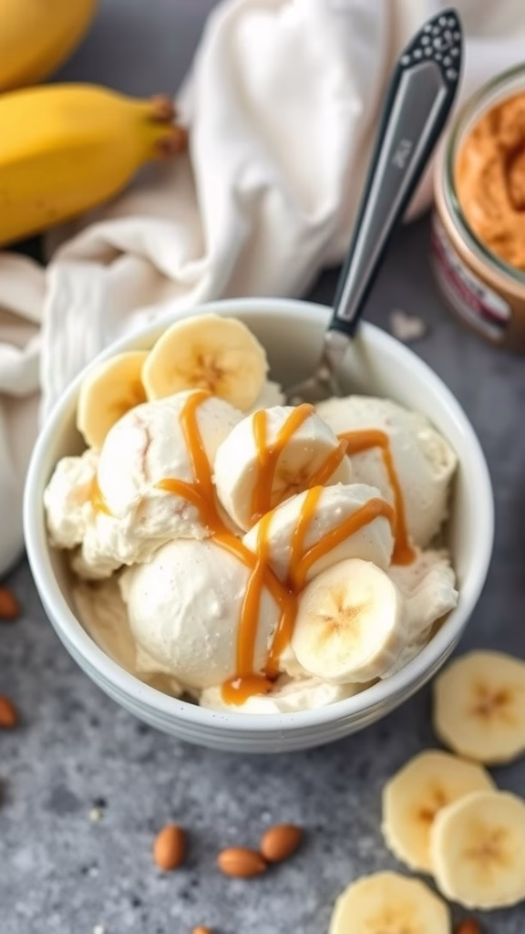 A bowl of peanut butter banana nice cream topped with banana slices and drizzled peanut butter.