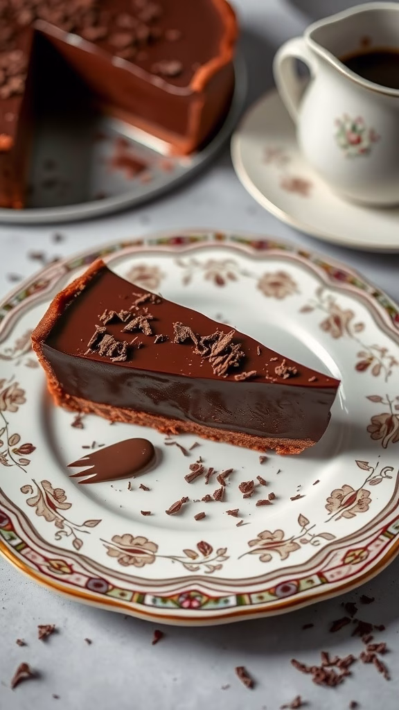 A slice of silky chocolate ganache pie on a decorative plate with chocolate shavings